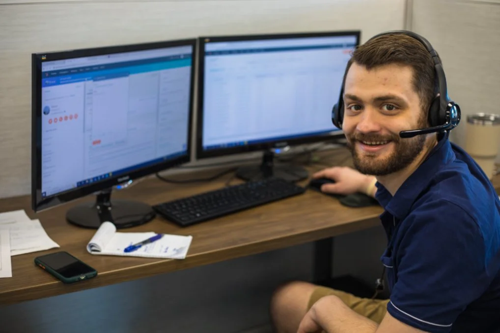 Fleet manager working in the Blue Ink Tech web portal reviewing ELD logbooks and managing alerts on the dashboard