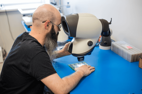 Blue Ink Tech's skilled technician  reviewing boards for quality control
