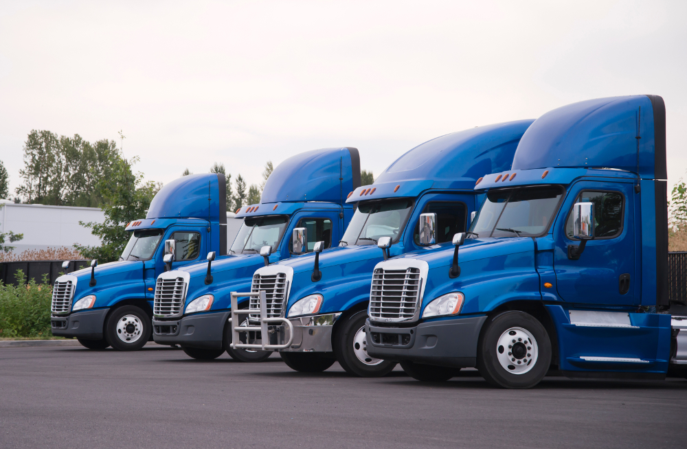 A fleet of blue trucks indication the blue ink tech is targeted at trucking companies